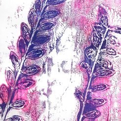 Purple and pink prints of leafy branches with textured background on a vibrant monoprint artwork.
